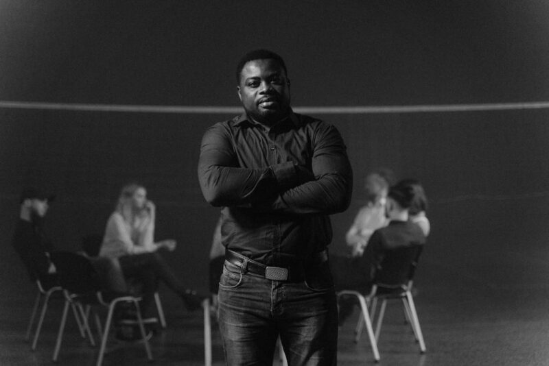 Counselor standing in front of clients